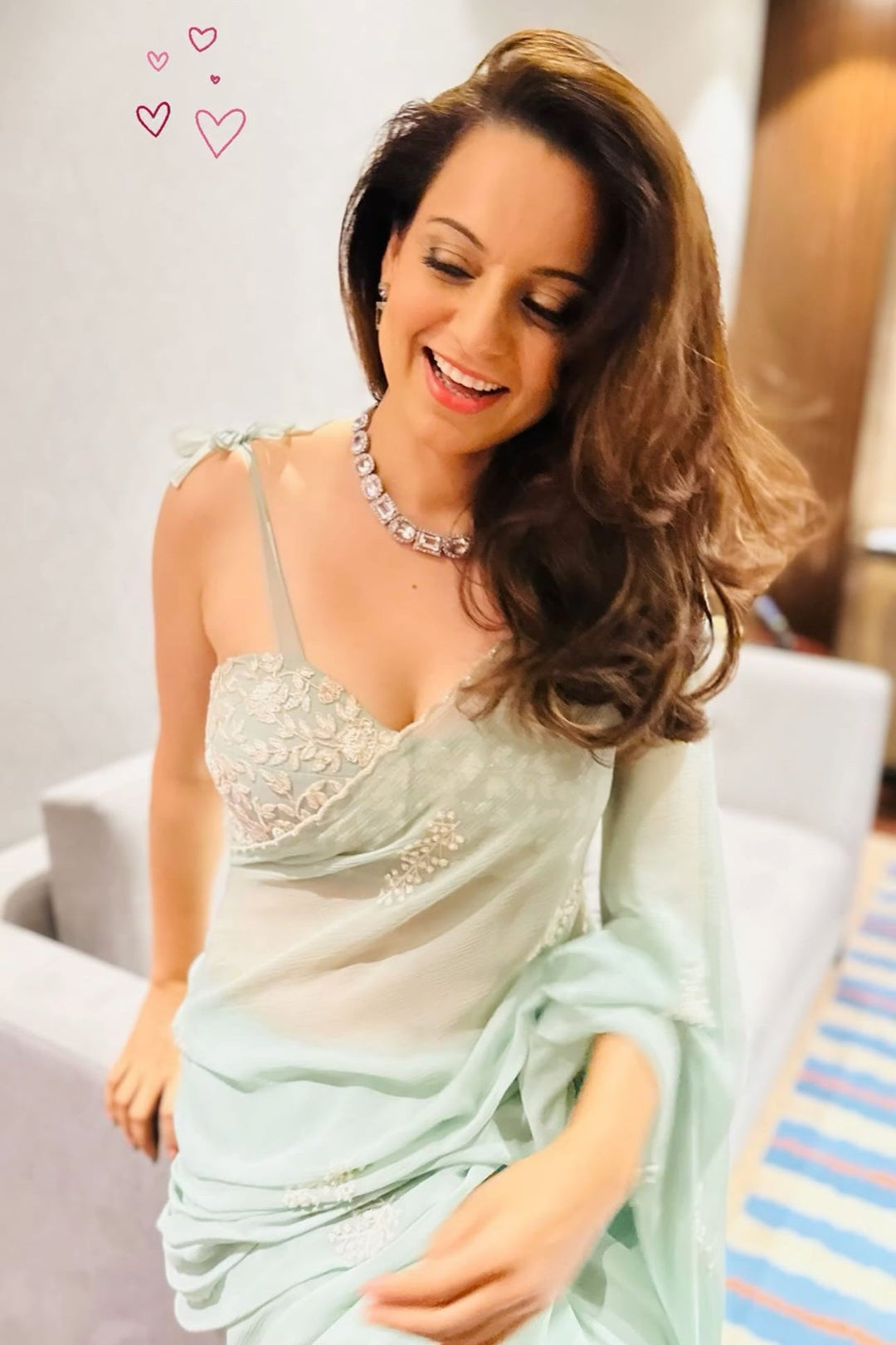 Sonali Bendre in mint green embroidered kurta set with delicate floral detailing, celebrity-inspired festive wear