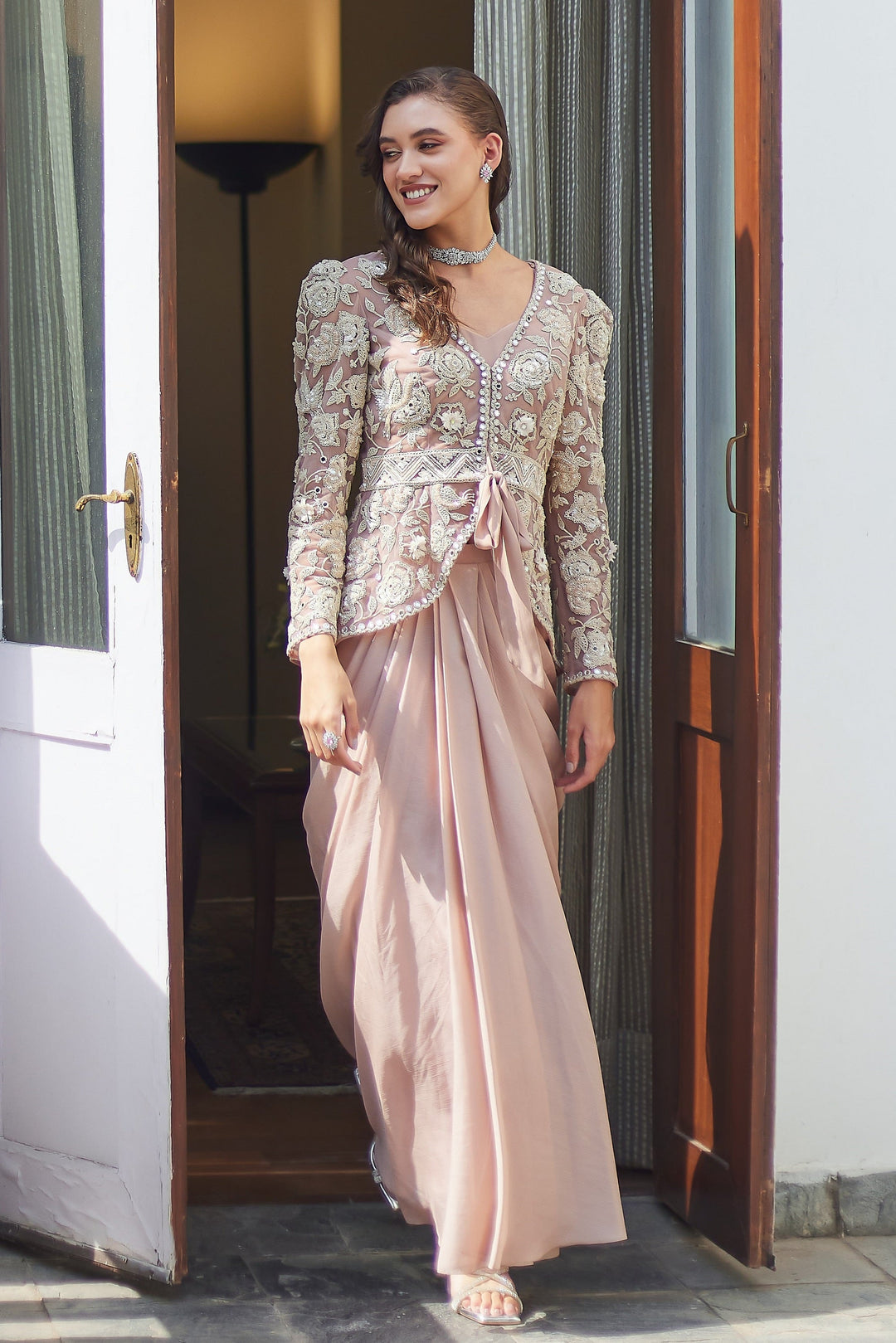 Model wearing embroidered sharara set