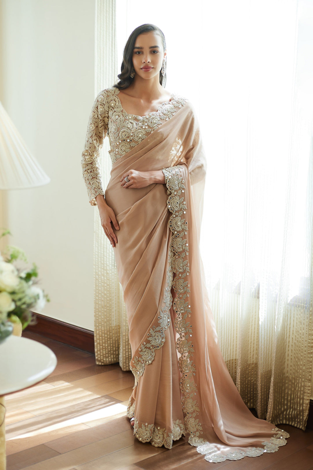 Model wearing embroidered georgette saree