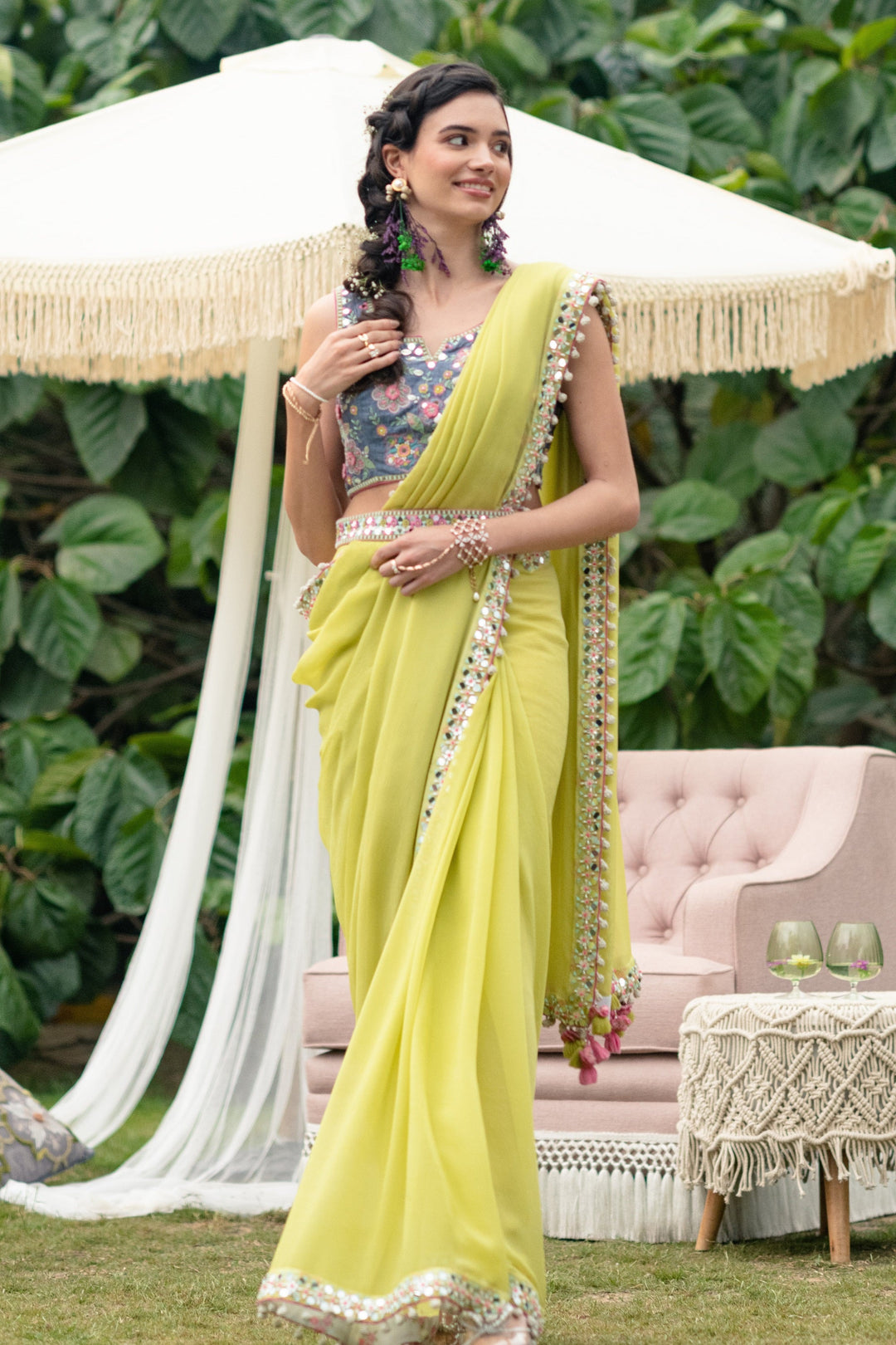 Woman wearing green saree from Mehendi collection with elegant drape and festive styling