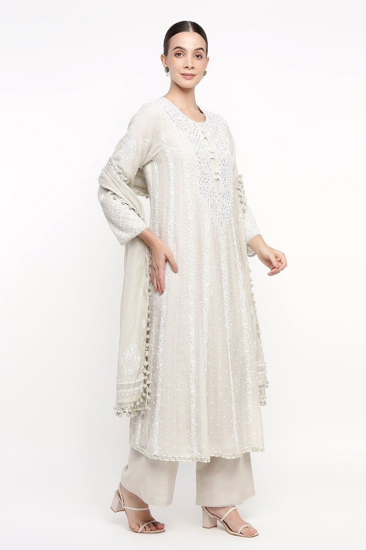 Woman wearing a white traditional outfit with a white background