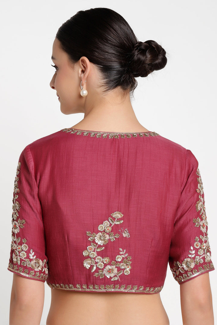 Maroon blouse with floral embroidery on a white background