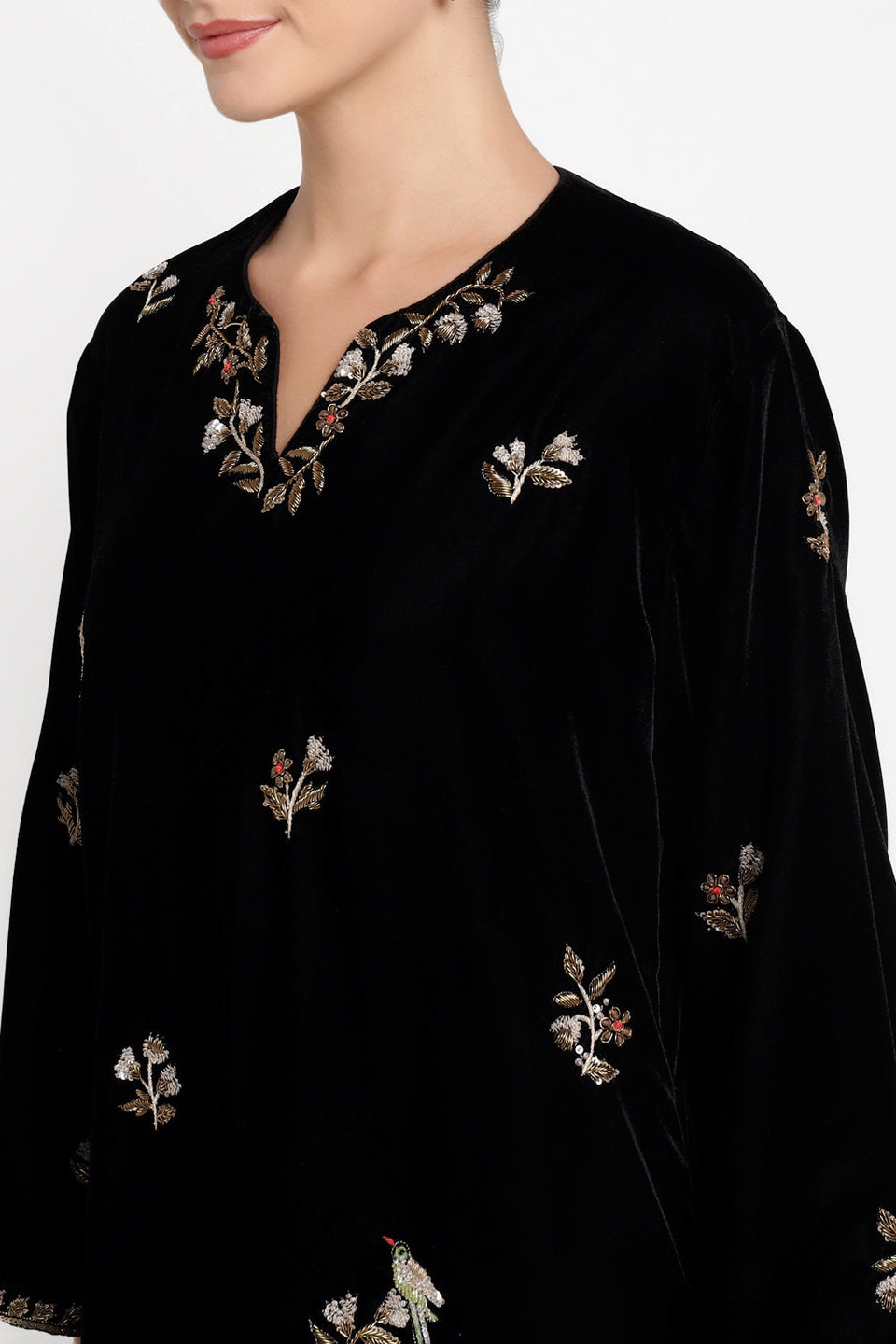 Black embroidered garment on a white background