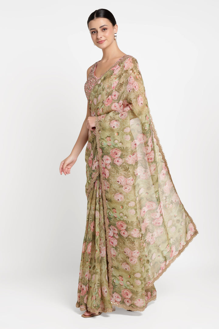 Woman wearing a floral saree with a white background