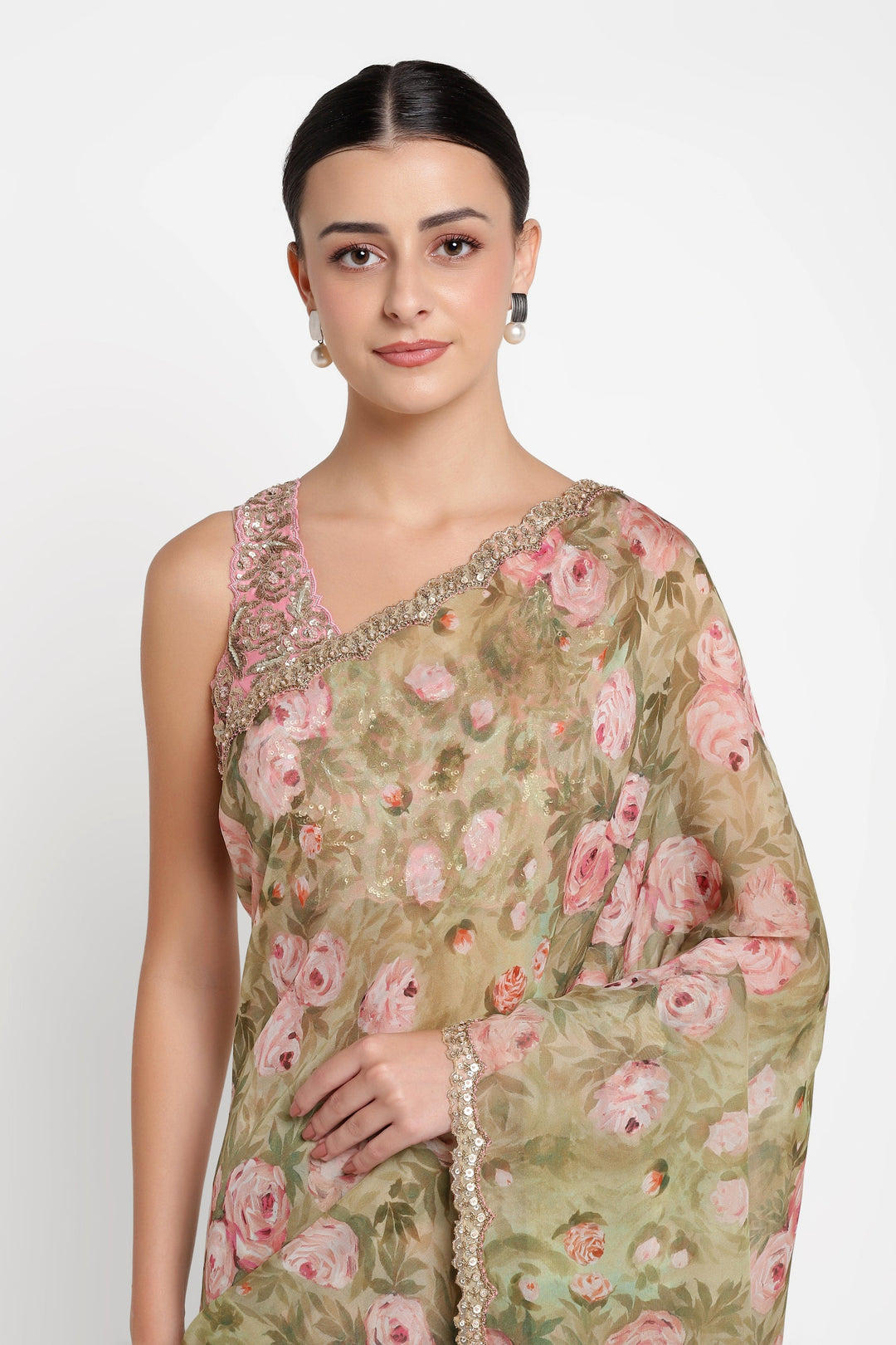 Woman wearing a floral saree with a white background