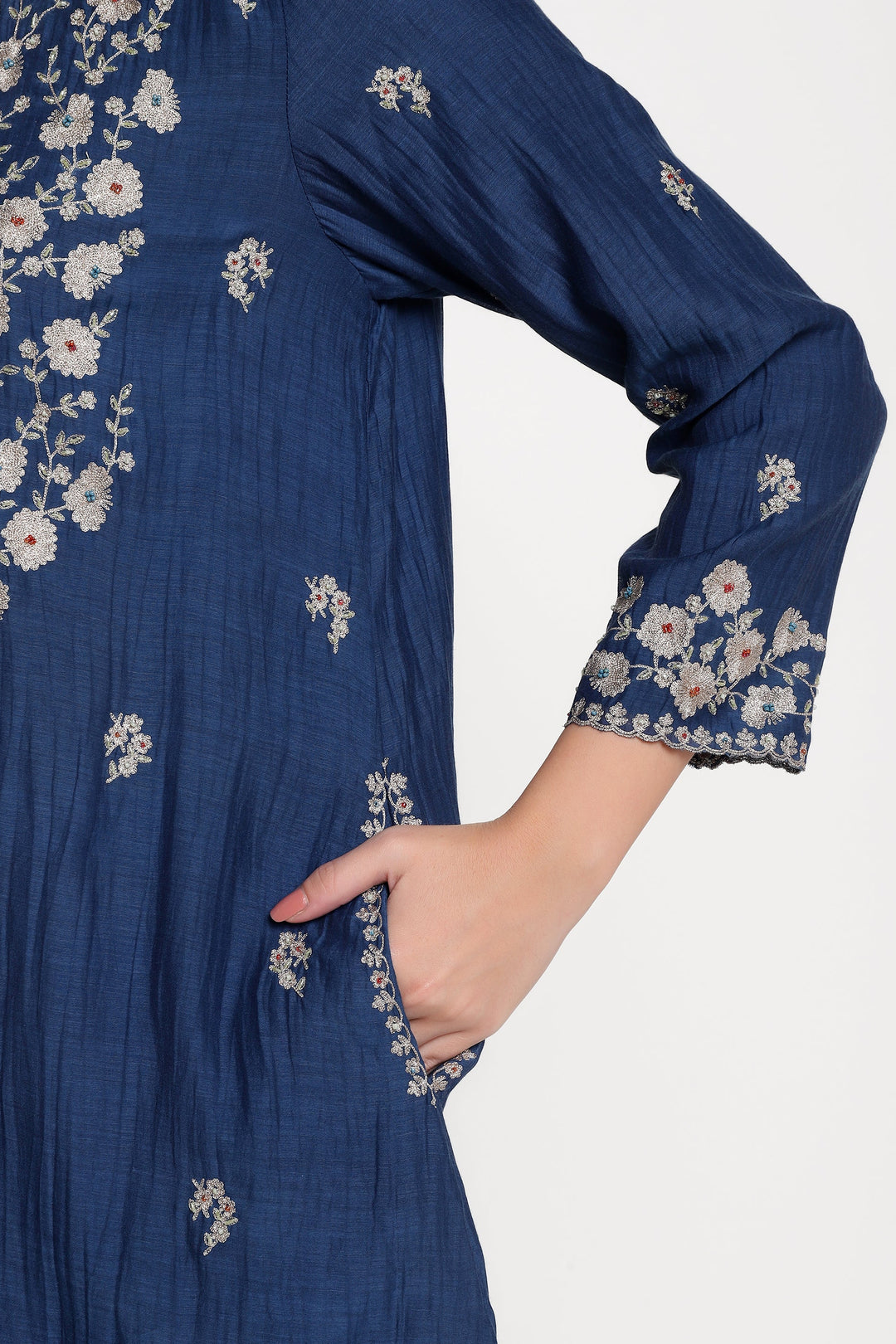 Navy blue dress with floral embroidery on a white background