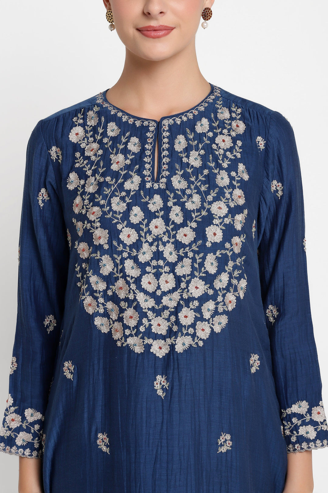 Navy blue kurta with white floral embroidery on a plain background