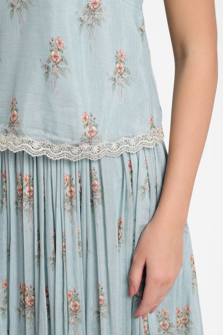 Light blue floral dress with lace trim on a white background