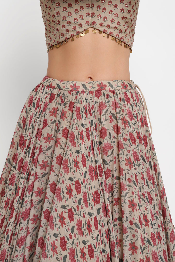 Floral patterned skirt with a matching top on a plain background
