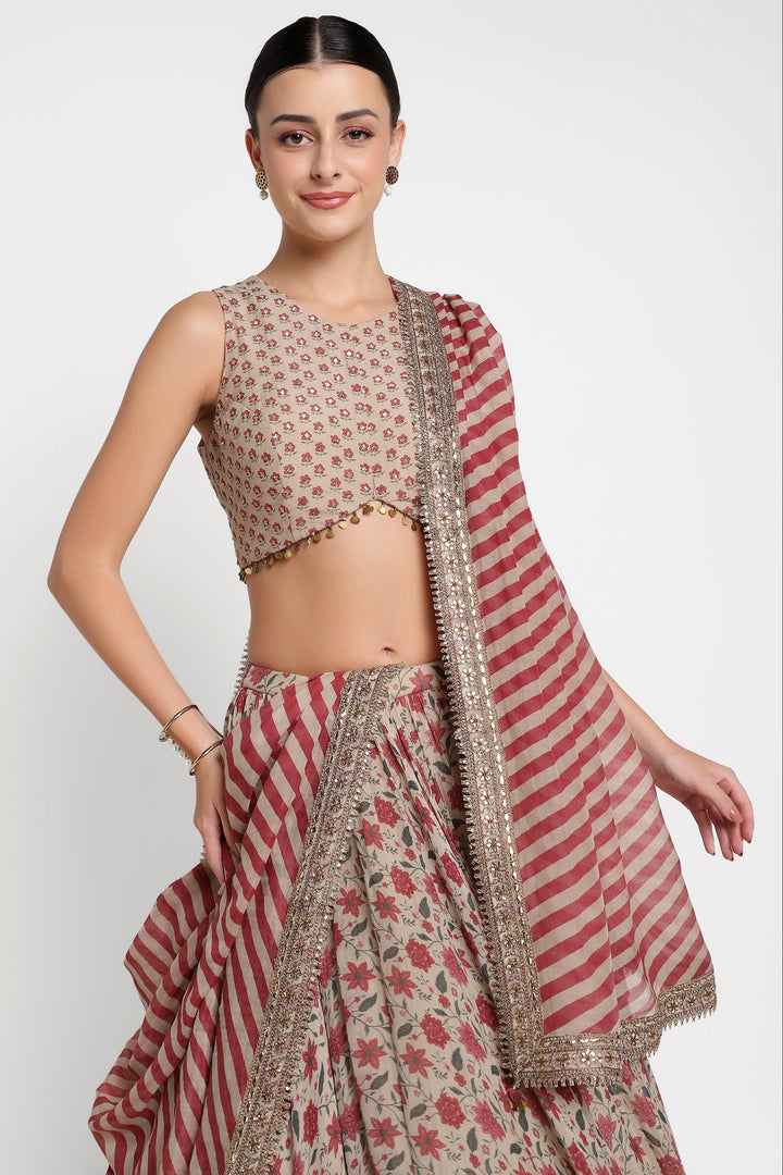 Woman wearing a traditional outfit with a red and beige pattern on a white background