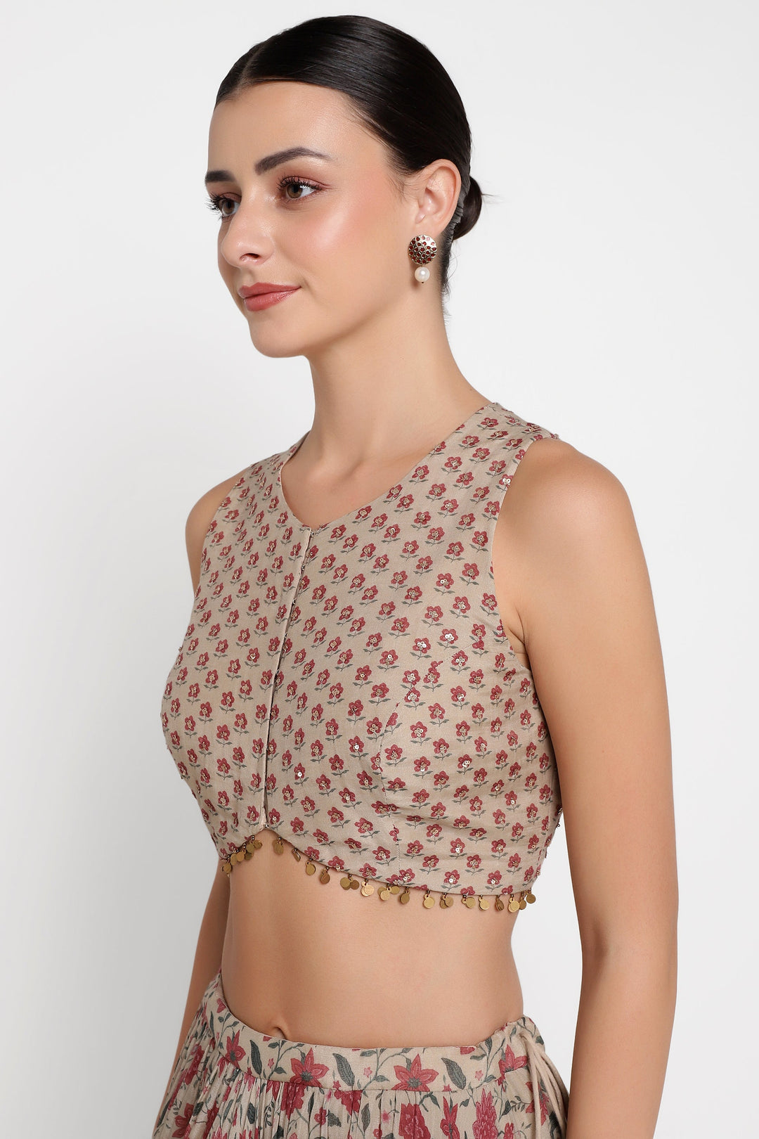 Woman wearing a floral blouse with a plain background