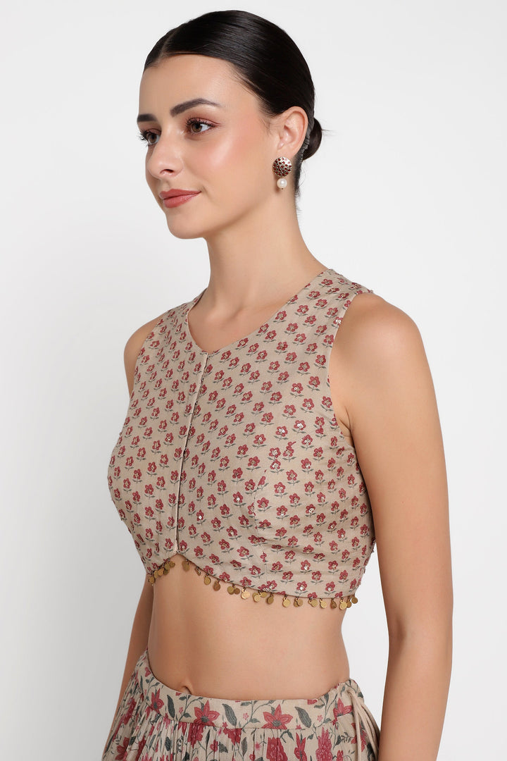 Woman wearing a floral blouse with a plain background