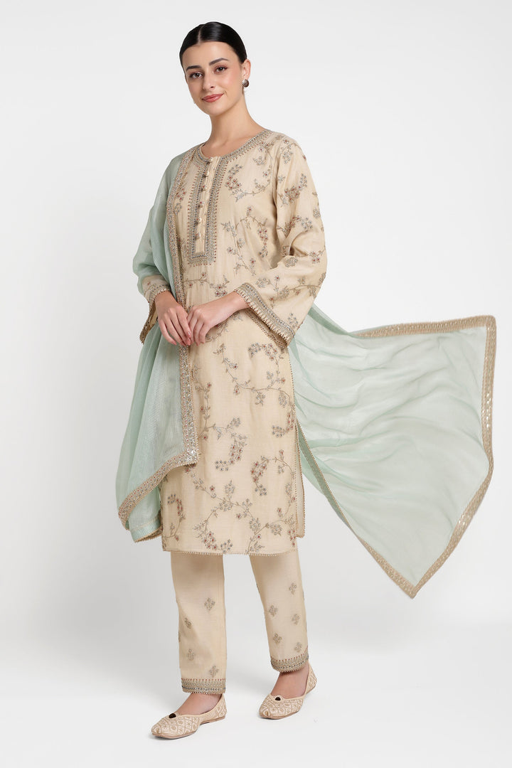 Woman wearing a traditional outfit with a floral pattern on a white background