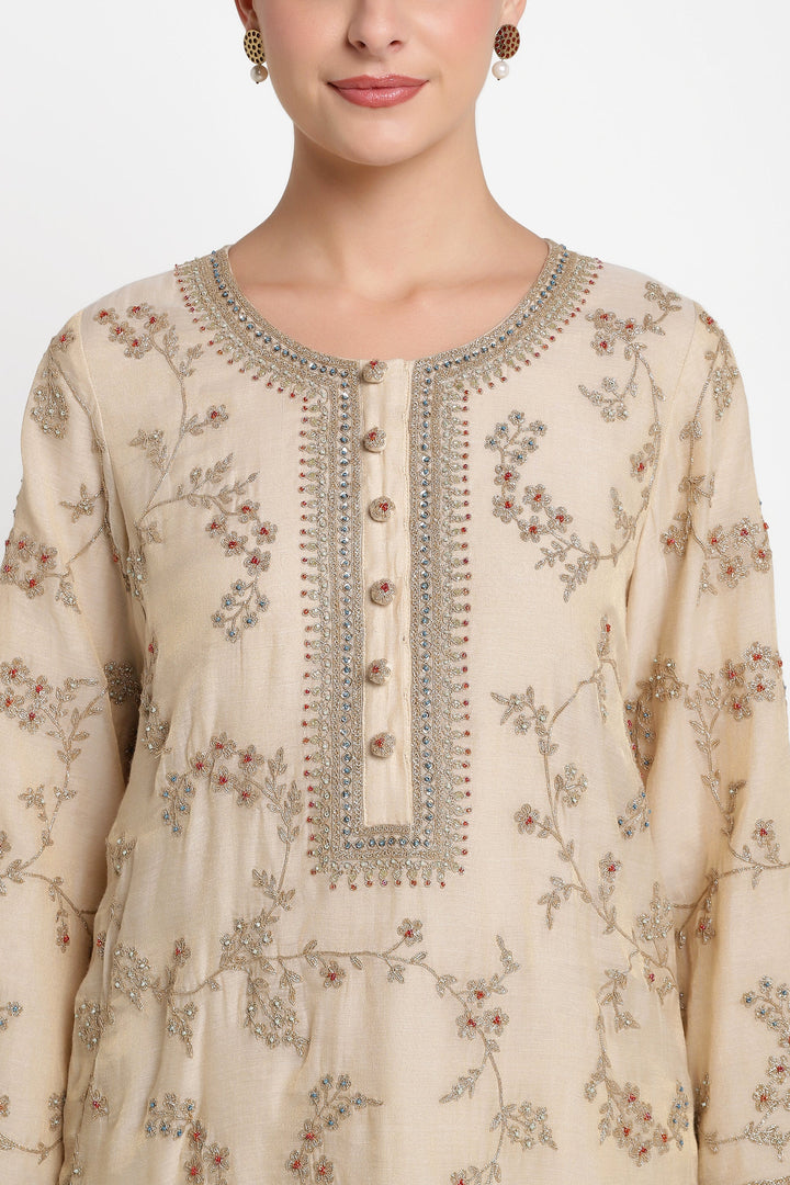 Beige embroidered kurta with floral patterns on a white background