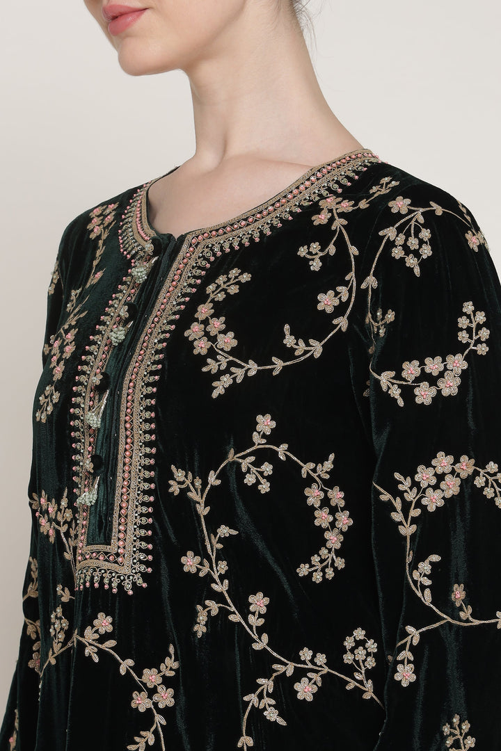 Black embroidered garment with intricate patterns on a plain background