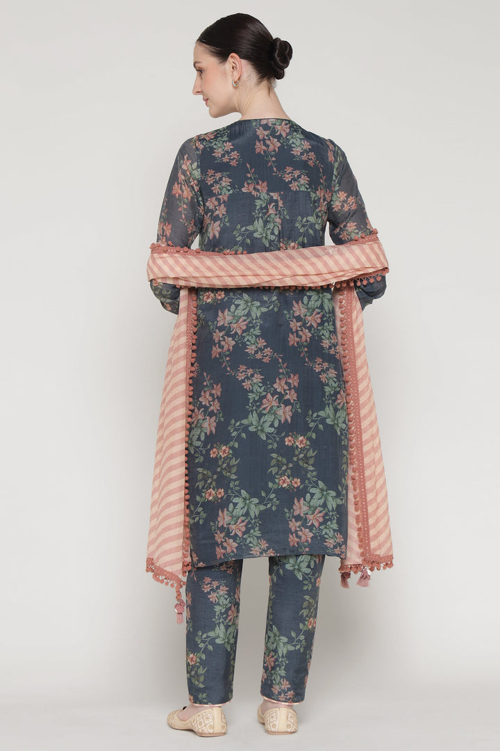 Woman wearing a floral outfit with a pink border on a white background